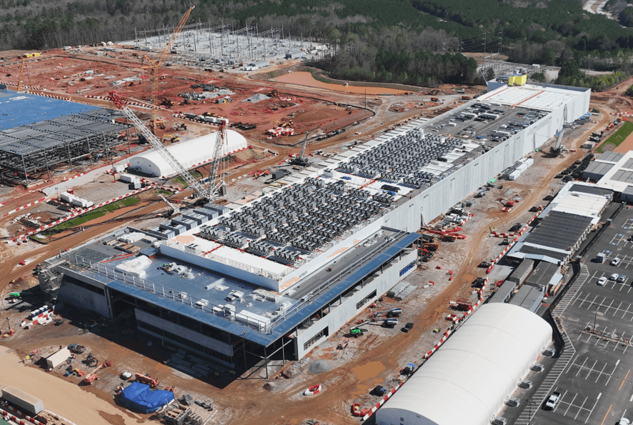 Program managers reviewing construction schedules on-site