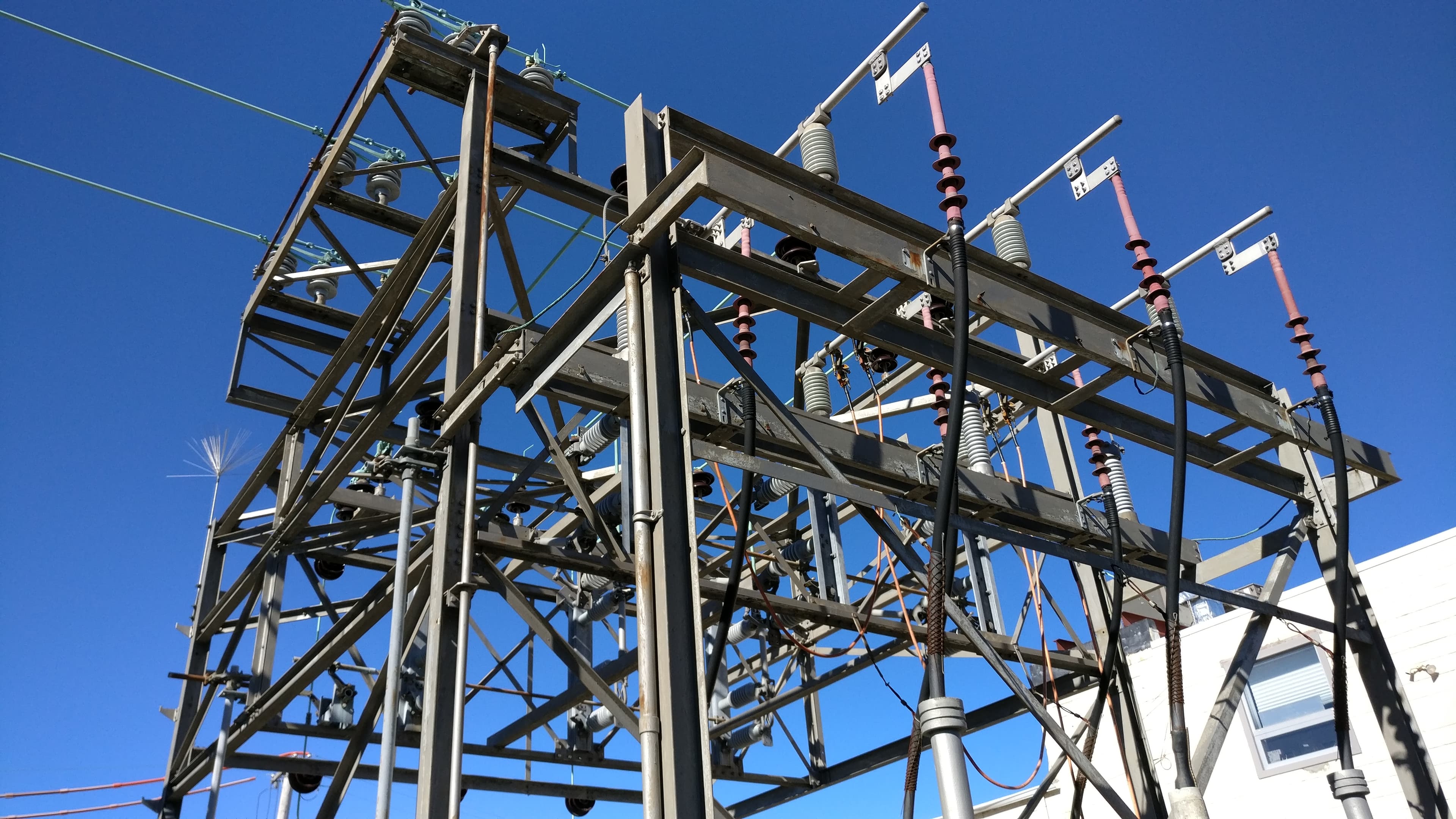 Engineers collaborating with digital models in an office